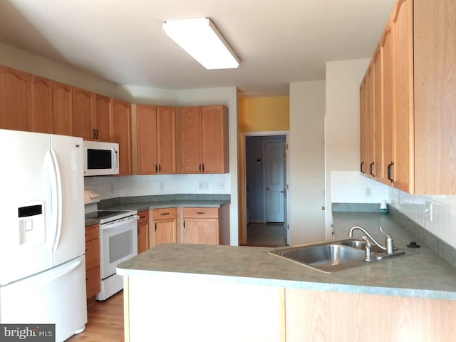 1372 Summerswood Dr, Saint Thomas, PA 17252 - kitchen featuring white appliances, a sink, a peninsula, and backsplash