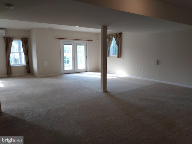 1372 Summerswood Dr, Saint Thomas, PA 17252 - unfurnished room featuring light colored carpet, a wall mounted air conditioner, french doors, and baseboards