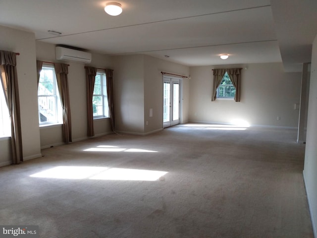 1372 Summerswood Dr, Saint Thomas, PA 17252 - spare room featuring a wall unit AC, healthy amount of natural light, and carpet flooring