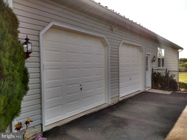 1372 Summerswood Dr, Saint Thomas, PA 17252 - garage with asphalt driveway and fence