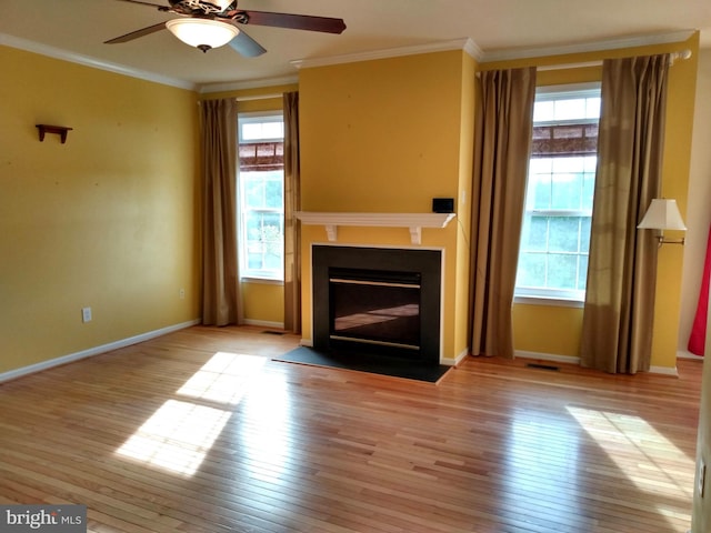 1372 Summerswood Dr, Saint Thomas, PA 17252 - unfurnished living room with wood-type flooring, a ceiling fan, crown molding, a fireplace with flush hearth, and baseboards