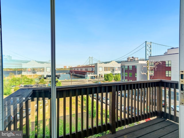 balcony featuring a water view