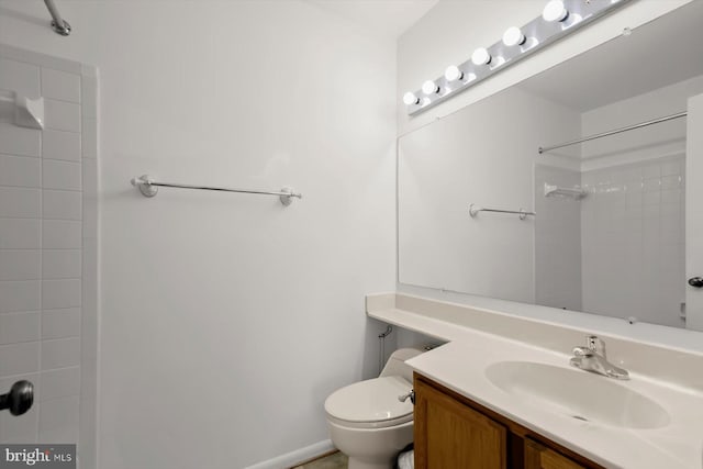 full bath featuring a shower, toilet, and vanity