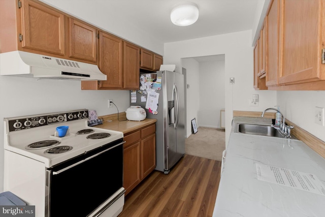 kitchen featuring white electric stove, under cabinet range hood, a sink, stainless steel fridge with ice dispenser, and light countertops