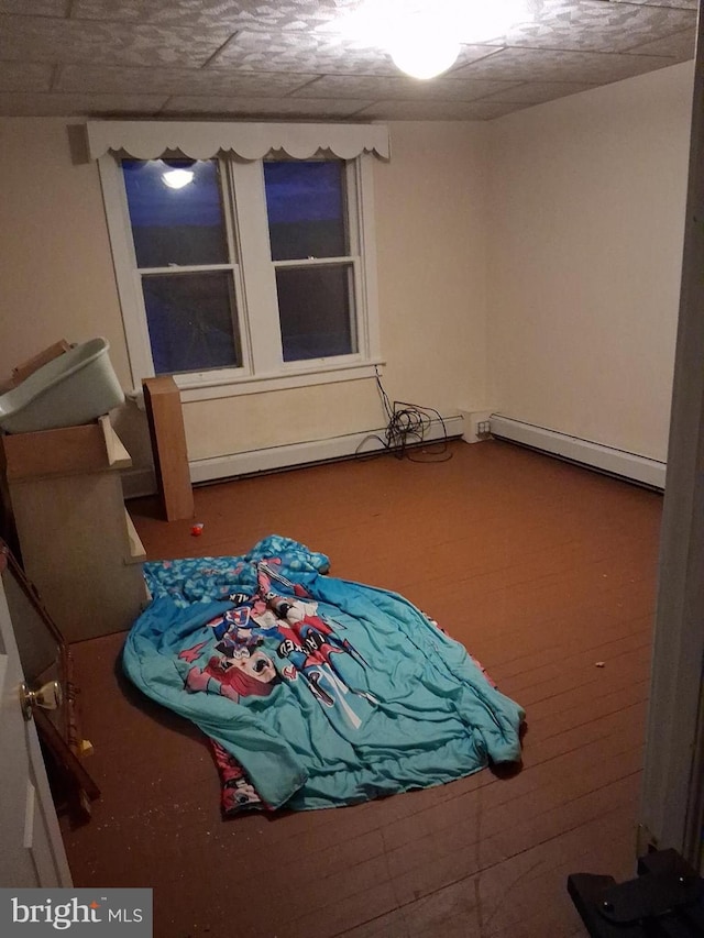 bedroom with a baseboard heating unit