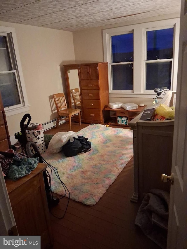 bedroom featuring wood finished floors