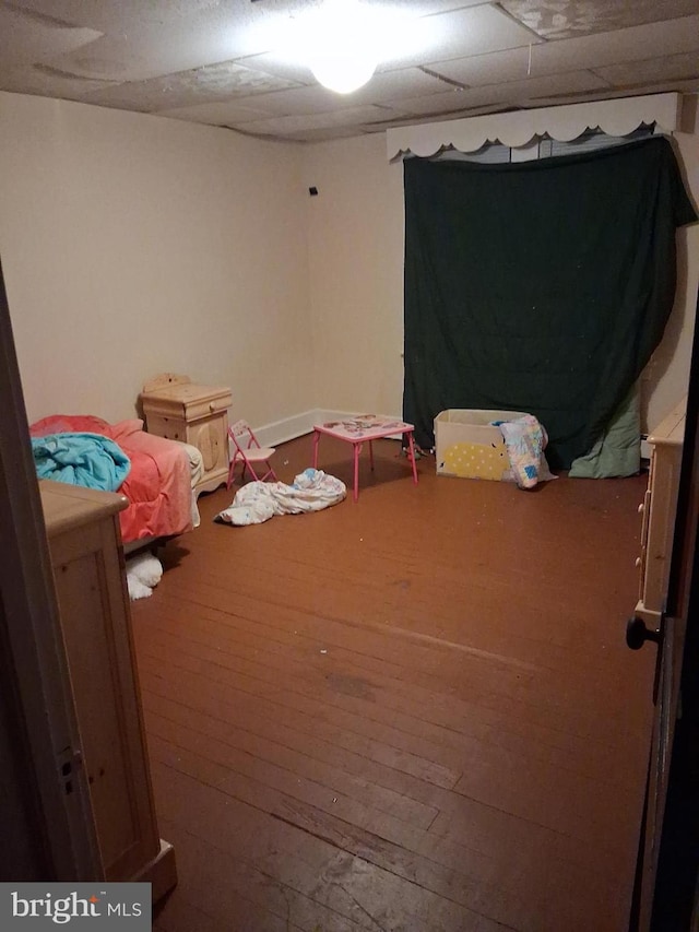 bedroom with hardwood / wood-style floors