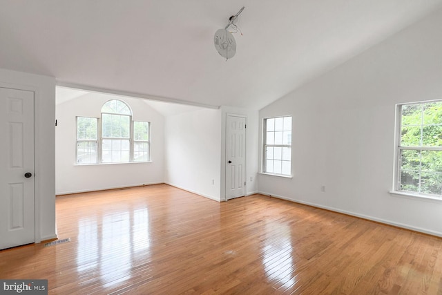 8916 Gladeside Dr, Clinton, MD 20735 - unfurnished room with lofted ceiling, healthy amount of natural light, and light wood finished floors