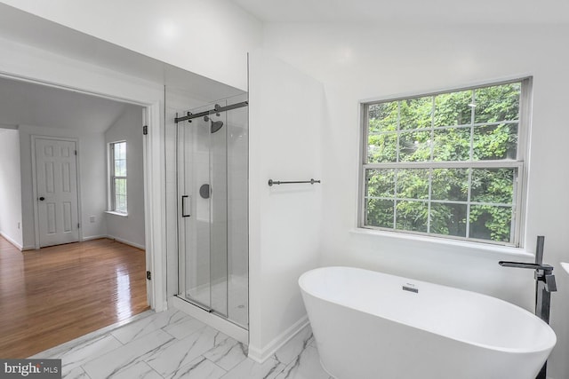 8916 Gladeside Dr, Clinton, MD 20735 - full bath with a soaking tub, a shower stall, and marble look tiles
