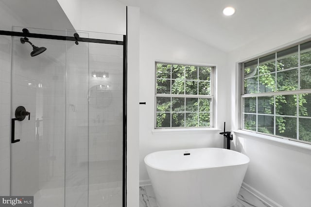8916 Gladeside Dr, Clinton, MD 20735 - full bathroom with marble look tile flooring, healthy amount of natural light, a freestanding tub, vaulted ceiling, and recessed lighting