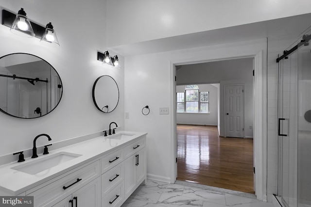 8916 Gladeside Dr, Clinton, MD 20735 - bathroom featuring double vanity, a shower stall, and marble look tiles