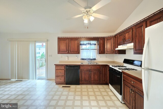 kitchen featuring freestanding refrigerator, gas stove, black dishwasher, a sink, and under cabinet range hood