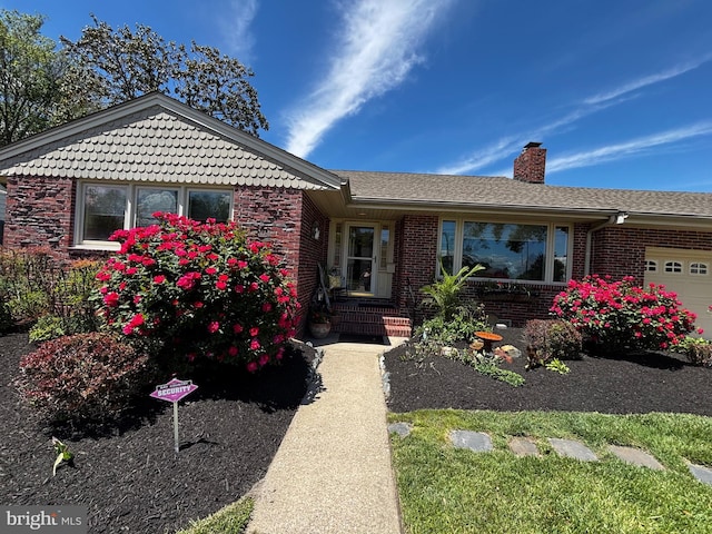 1 Somerset Ave, Cambridge, MD 21613 - single story home with brick siding, a chimney, and a garage