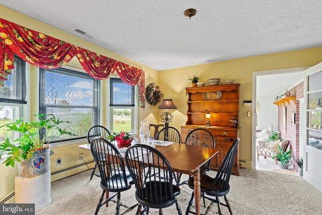 1 Somerset Ave, Cambridge, MD 21613 - dining area with carpet floors, a textured ceiling, and a baseboard heating unit