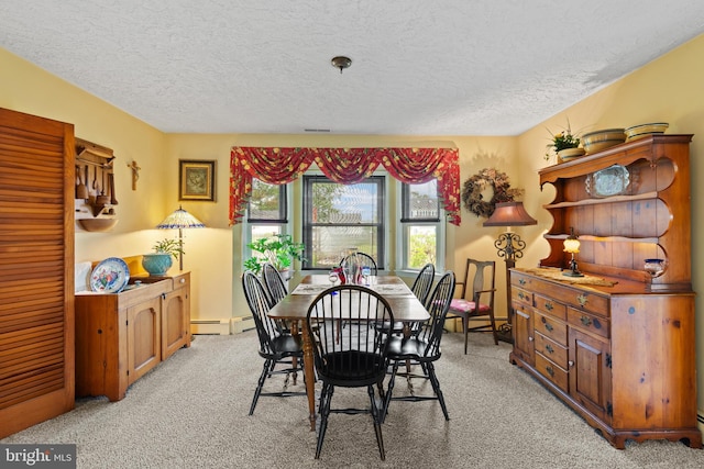 1 Somerset Ave, Cambridge, MD 21613 - dining space with a textured ceiling, light carpet, and a baseboard radiator