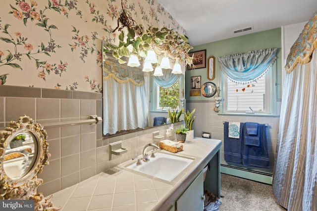 1 Somerset Ave, Cambridge, MD 21613 - bathroom featuring a baseboard heating unit, tile walls, a wainscoted wall, wallpapered walls, and vanity