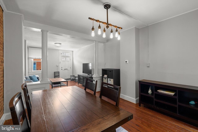 117 E Clement St, Baltimore, MD 21230 - dining area with decorative columns, hardwood / wood-style flooring, baseboards, and crown molding