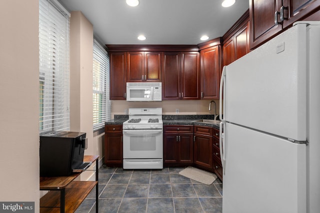 117 E Clement St, Baltimore, MD 21230 - kitchen with white appliances, dark countertops, a sink, dark tile patterned flooring, and recessed lighting