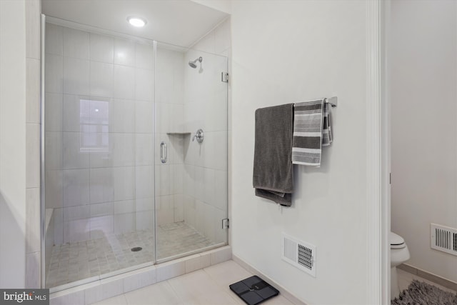 8423 Reformatory Way, Lorton, VA 22079 - bathroom with a shower stall, toilet, baseboards, and tile patterned floors
