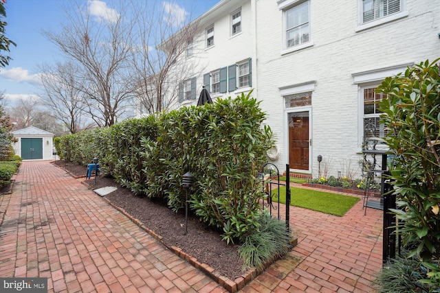300 S Columbus St, Alexandria, VA 22314 - view of patio featuring an outbuilding and a shed