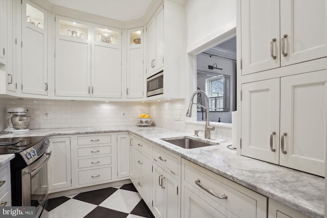 300 S Columbus St, Alexandria, VA 22314 - kitchen featuring a sink, stainless steel appliances, and white cabinets