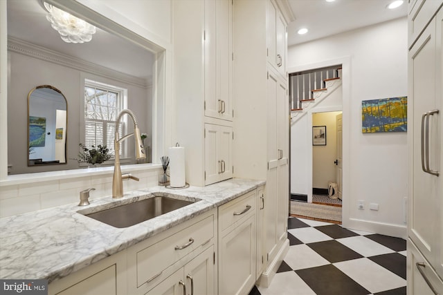 300 S Columbus St, Alexandria, VA 22314 - kitchen featuring a sink, tile patterned floors, recessed lighting, white cabinetry, and baseboards