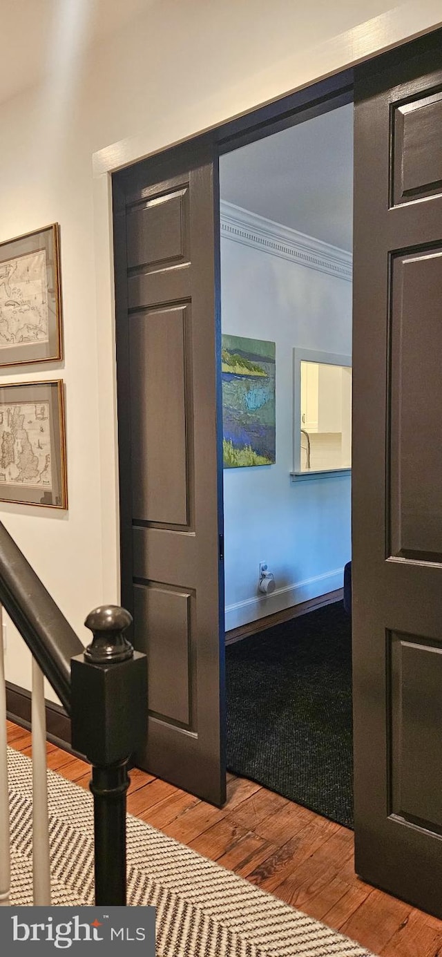 300 S Columbus St, Alexandria, VA 22314 - corridor featuring ornamental molding, wood finished floors, and baseboards