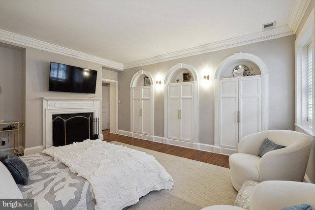 300 S Columbus St, Alexandria, VA 22314 - bedroom with crown molding, wood finished floors, a fireplace, and baseboards