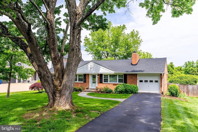 view of front of house featuring an attached garage, brick siding, asphalt driveway, a chimney, and a shingled roof