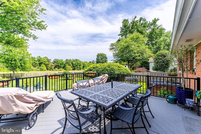 wooden deck featuring outdoor dining space