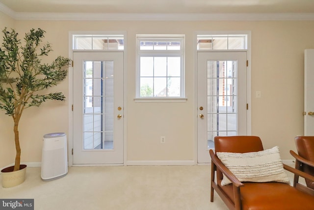 9712 Handerson Pl Unit 306, Manassas Park, VA 20111 - doorway featuring crown molding, plenty of natural light, carpet flooring, and baseboards