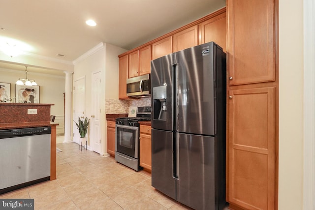 9712 Handerson Pl Unit 306, Manassas Park, VA 20111 - kitchen featuring stainless steel appliances, crown molding, dark countertops, backsplash, and light tile patterned flooring