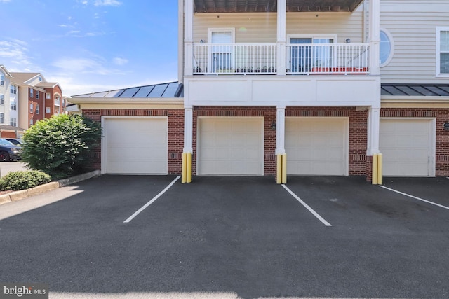 9712 Handerson Pl Unit 306, Manassas Park, VA 20111 - multi unit property featuring a standing seam roof, brick siding, and metal roof