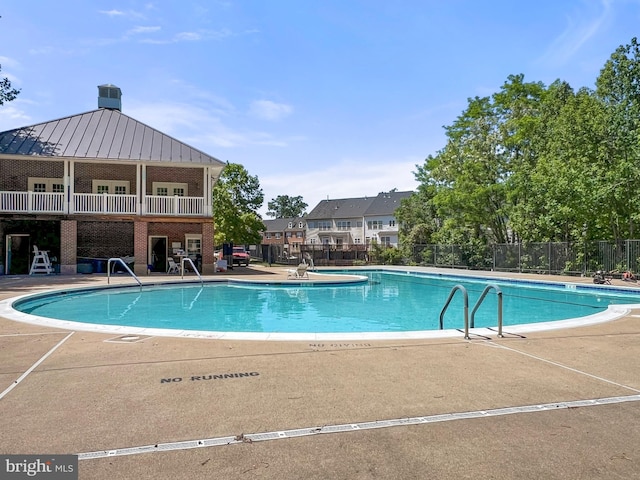 9712 Handerson Pl Unit 306, Manassas Park, VA 20111 - community pool featuring fence and a patio