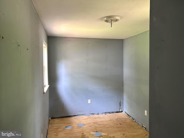 unfurnished room with wood finished floors