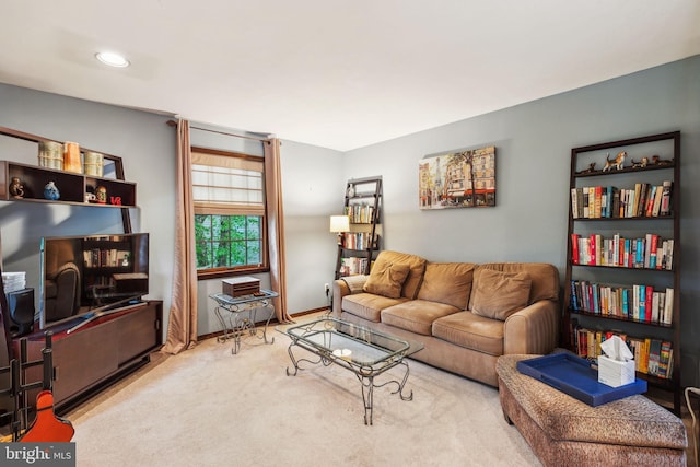 carpeted living room featuring baseboards and recessed lighting