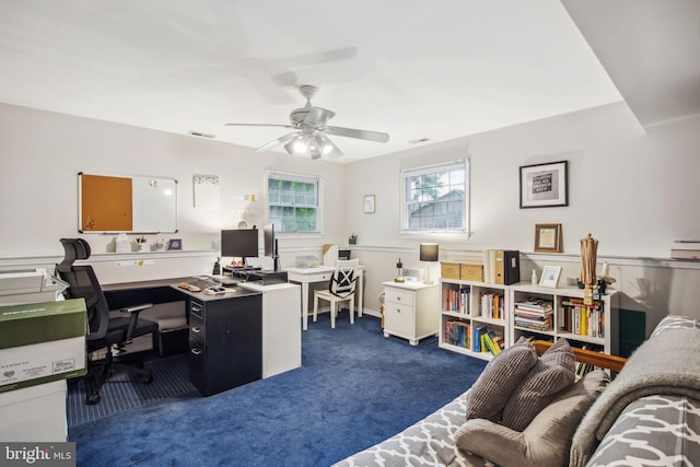 office area with dark colored carpet and ceiling fan