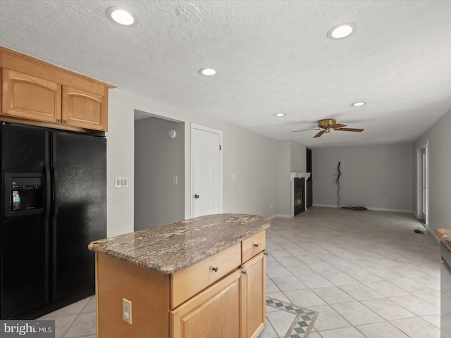 10205 Scaggsville Rd, Laurel, MD 20723 - kitchen featuring black fridge with ice dispenser, a ceiling fan, recessed lighting, dark stone counters, and light tile patterned floors