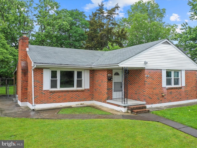233 Molden Dr, Winchester, VA 22601 - view of front facade with brick siding, a chimney, and roof with shingles