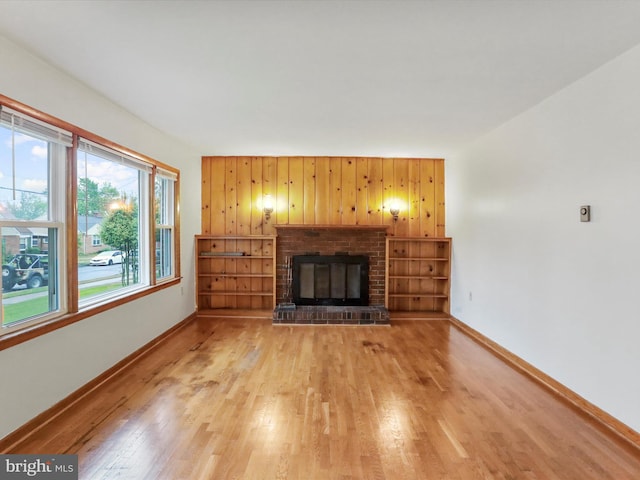 233 Molden Dr, Winchester, VA 22601 - unfurnished living room featuring light wood-type flooring, baseboards, and a fireplace