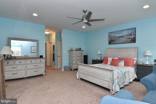 bedroom with light carpet, recessed lighting, and a ceiling fan