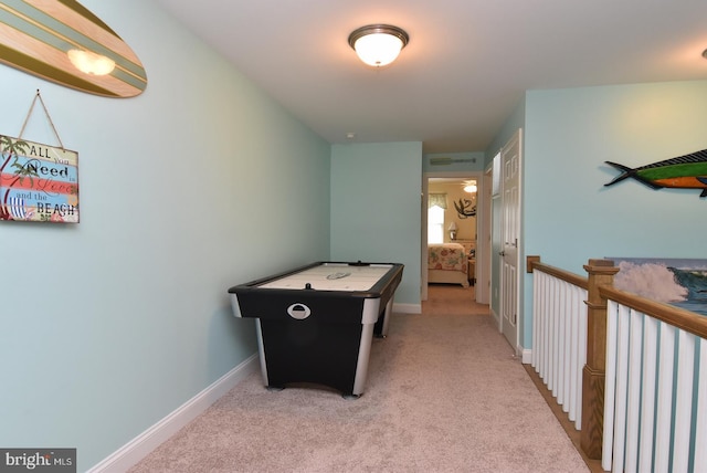rec room with carpet flooring and baseboards