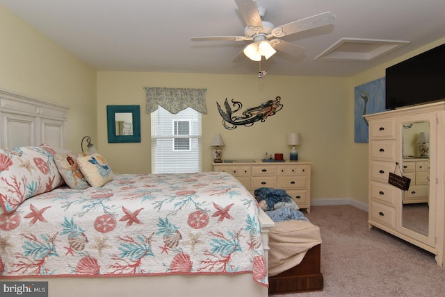 bedroom with light carpet and a ceiling fan