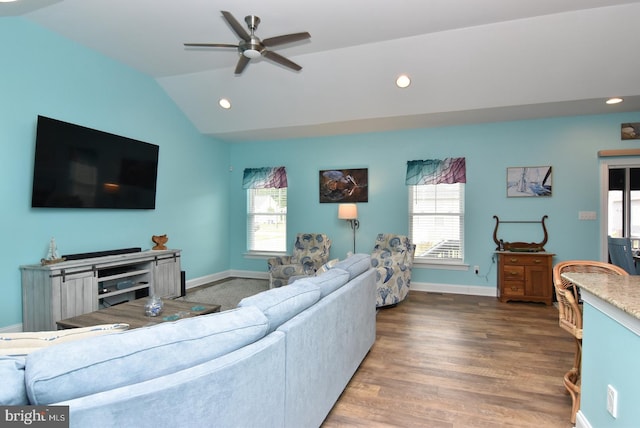 living area with a ceiling fan, recessed lighting, lofted ceiling, wood finished floors, and baseboards