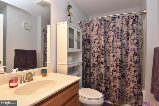 full bathroom with toilet and vanity
