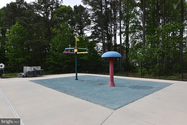view of basketball court featuring fence