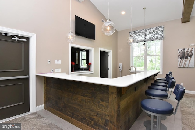 bar with light tile patterned flooring, baseboards, hanging light fixtures, and recessed lighting