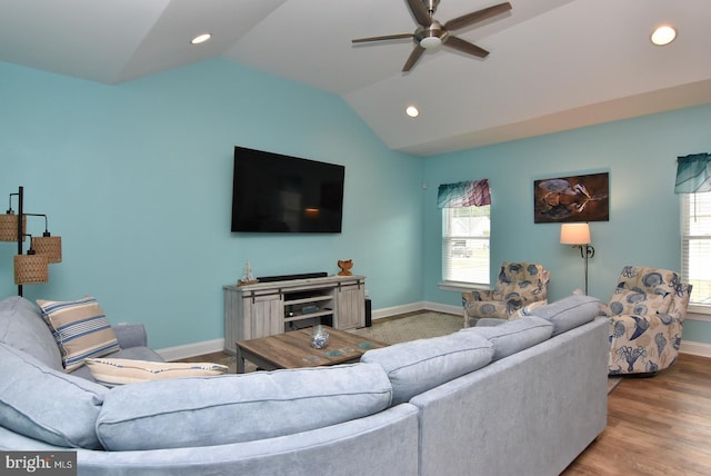 living room with a ceiling fan, vaulted ceiling, baseboards, plenty of natural light, and recessed lighting