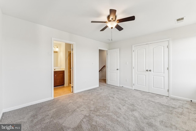 2924 Truffle Oak Pl, Woodbridge, VA 22191 - unfurnished bedroom with carpet flooring, a closet, baseboards, connected bathroom, and ceiling fan