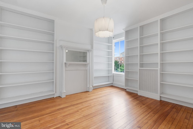 108 3rd St NE, Washington, DC 20002 - unfurnished room featuring built in shelves and light wood-style floors